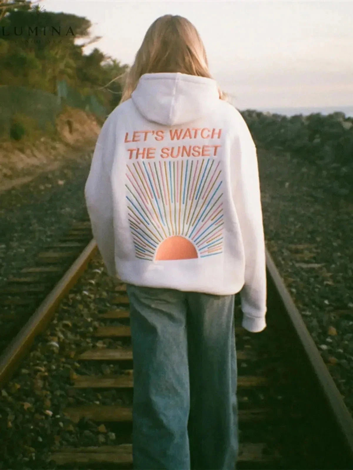 Women's hoodie with sunset graphic on the back