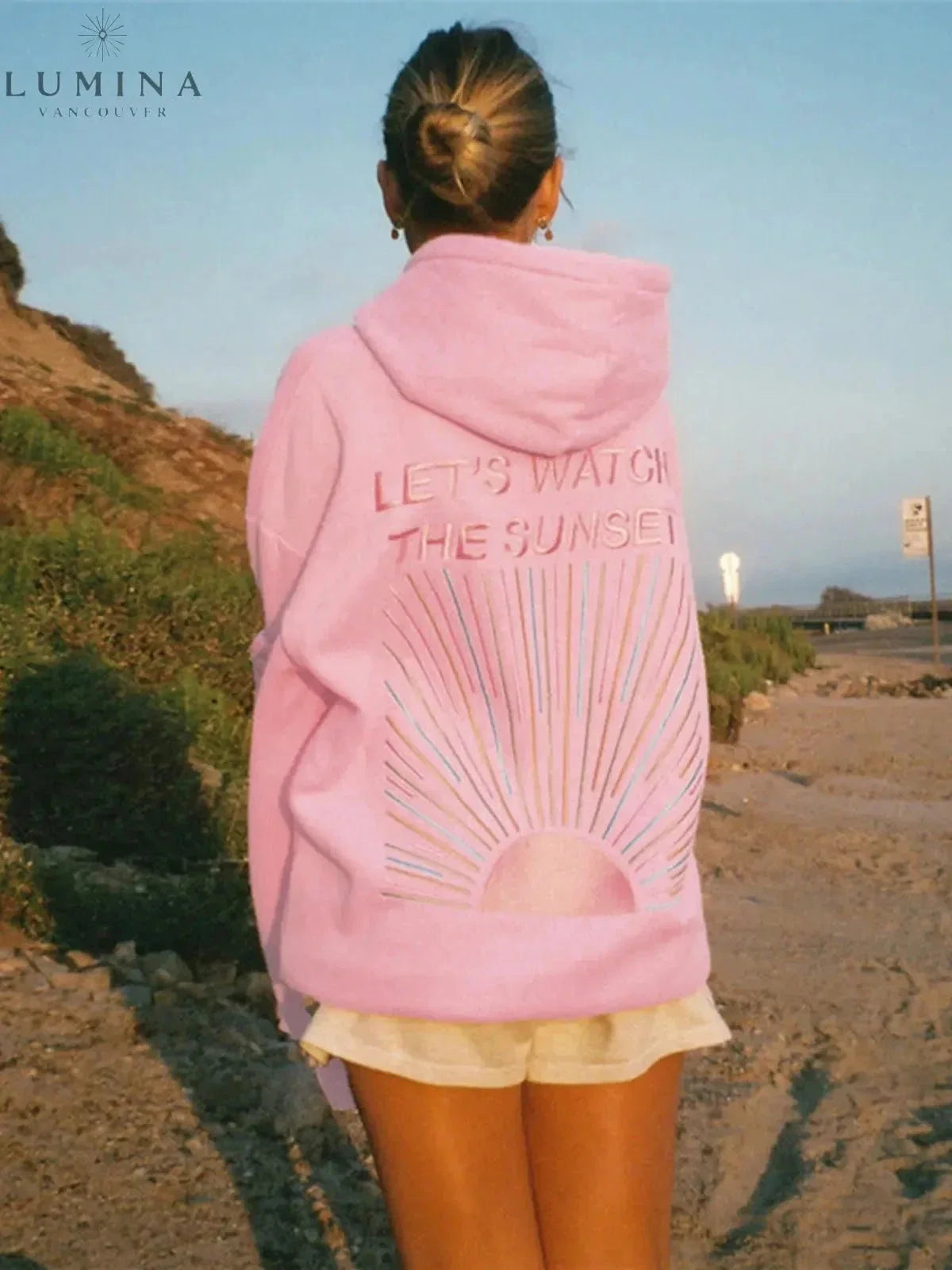 Women's hoodie with sunset graphic on the back