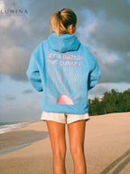 Women's hoodie with sunset graphic on the back