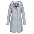 Women's longline hooded raincoat with zip and snap-button front