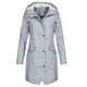 Women's longline hooded raincoat with zip and snap-button front