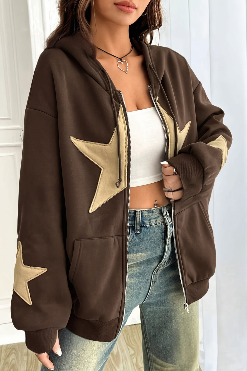 Women's oversized zip hoodie with contrasting star appliques, hood and kangaroo pockets