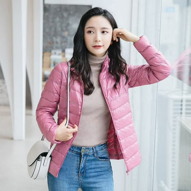 Women's quilted puffer jacket with high collar, long sleeves and front zip
