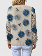 Women's floral V-neck sweater with long sleeves and open-knit sleeve panels