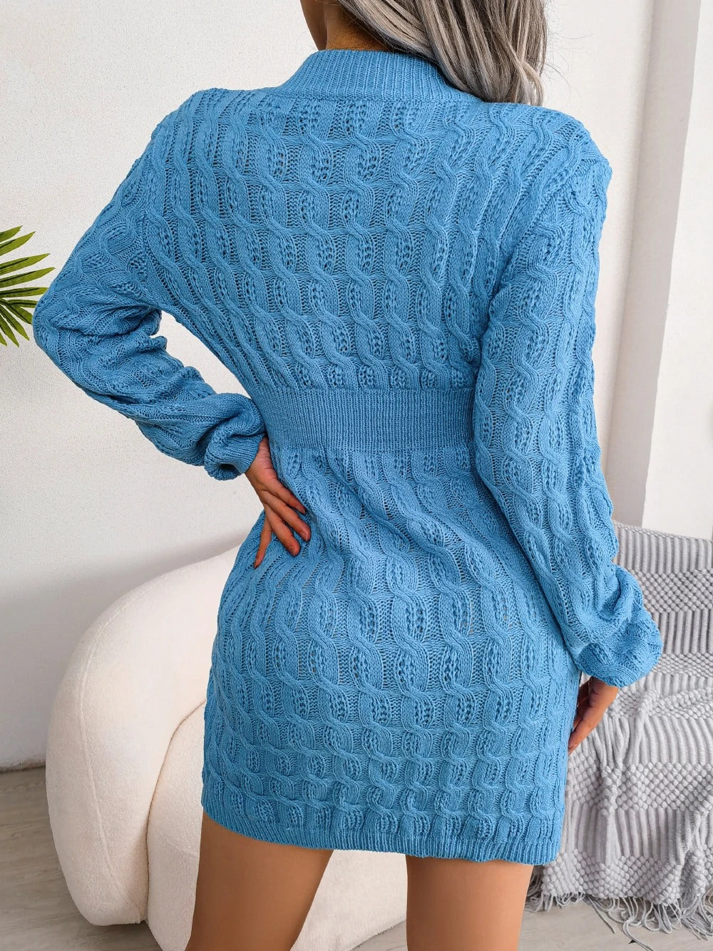 Women's cable knit sweater mini dress with crew neckline and long sleeves