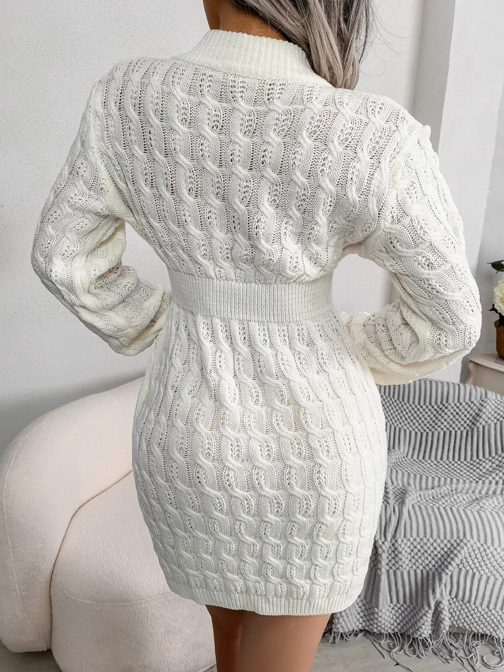 Women's cable knit sweater mini dress with crew neckline and long sleeves