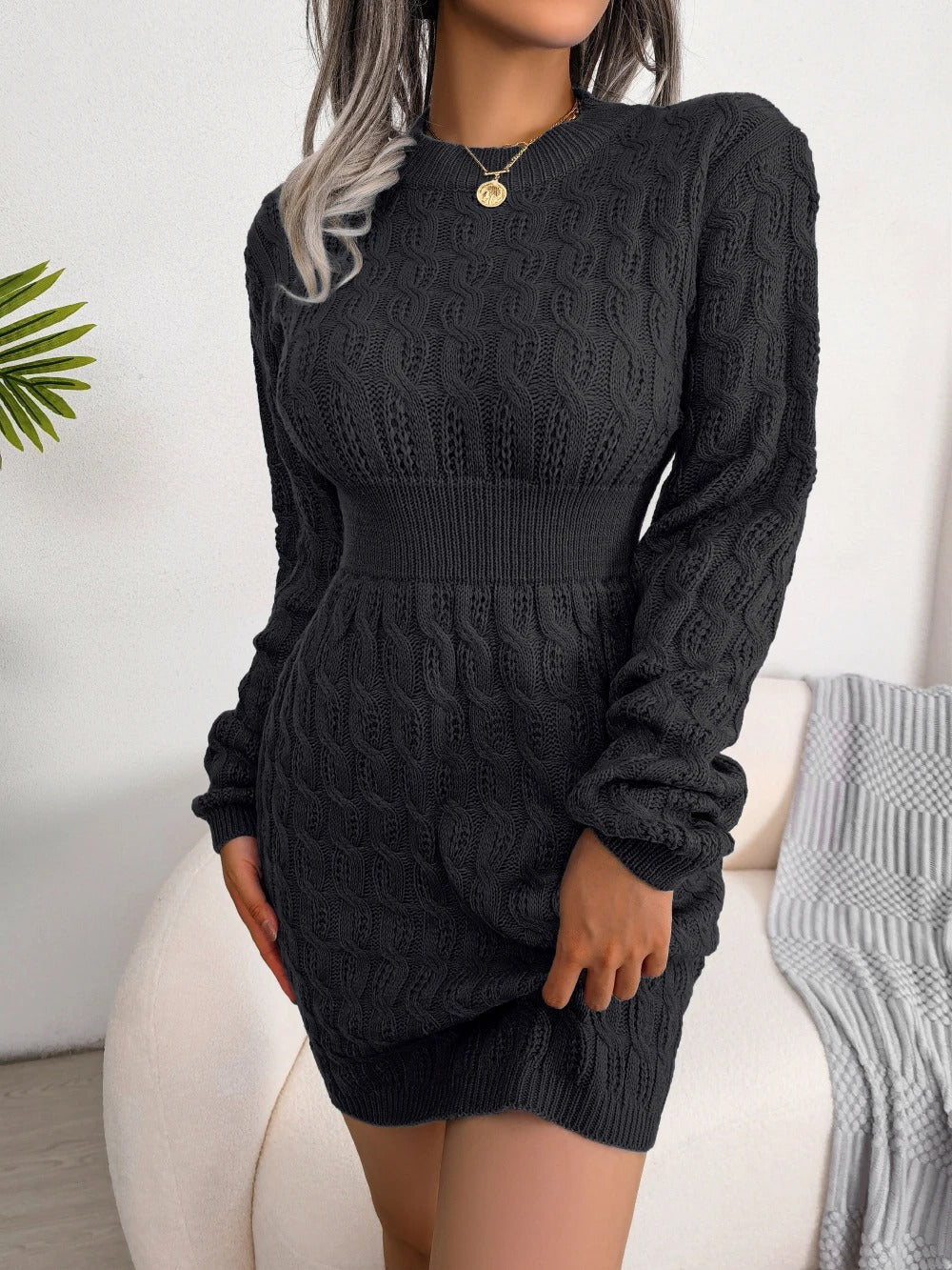 Women's cable knit sweater mini dress with crew neckline and long sleeves