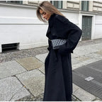 Women's black oversized long coat with lapel collar and button front