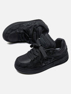 Black high-top skate trainers with textured panels and lace-up fastening