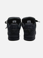 Black high-top skate trainers with textured panels and lace-up fastening