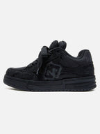 Black high-top skate trainers with textured panels and lace-up fastening