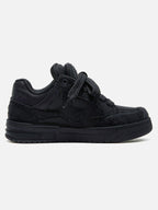 Black high-top skate trainers with textured panels and lace-up fastening