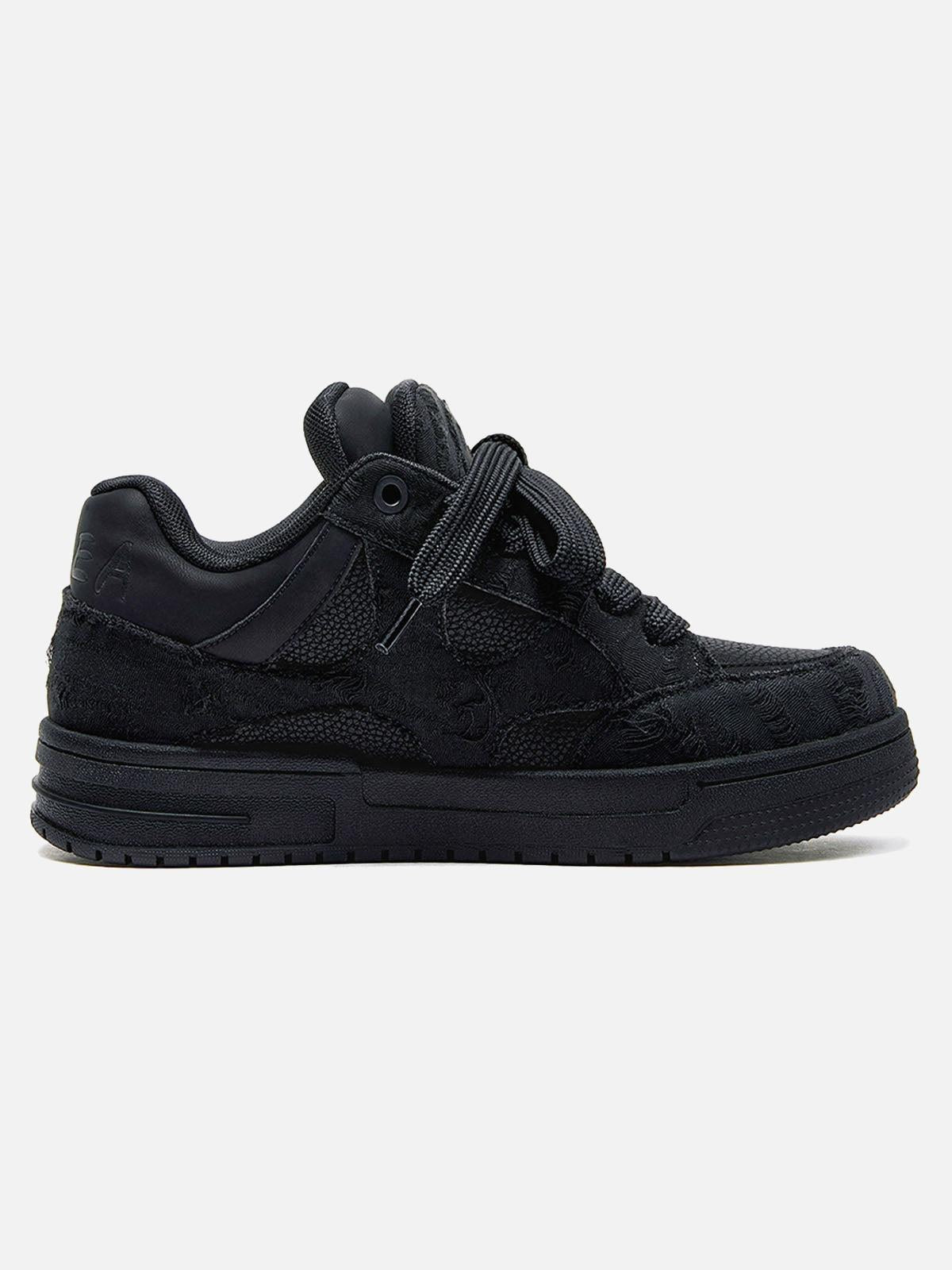 Black high-top skate trainers with textured panels and lace-up fastening