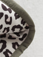 Women's quilted jacket with leopard-print cuffs and button front