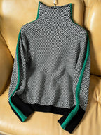 Women's geometric turtleneck sweater with contrasting sleeve stripes