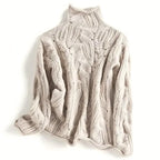 Women's cable knit turtleneck jumper with long sleeves and raised textured pattern