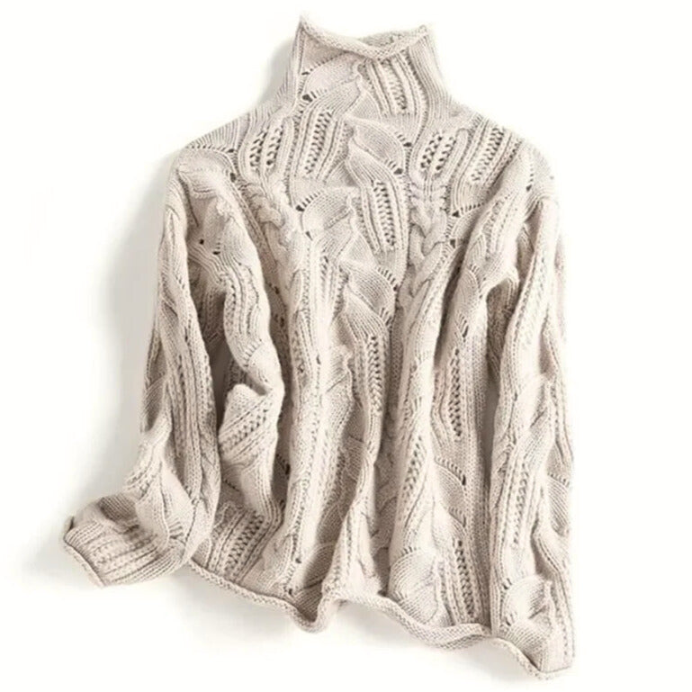 Women's cable knit turtleneck jumper with long sleeves and raised textured pattern