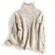 Women's cable knit turtleneck jumper with long sleeves and raised textured pattern