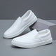 Men's slip-on loafers with rounded toes and contrasting white soles