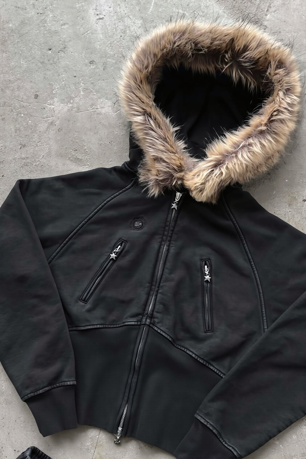 Women's black cropped zip hoodie with faux fur trimmed hood and zipped pockets