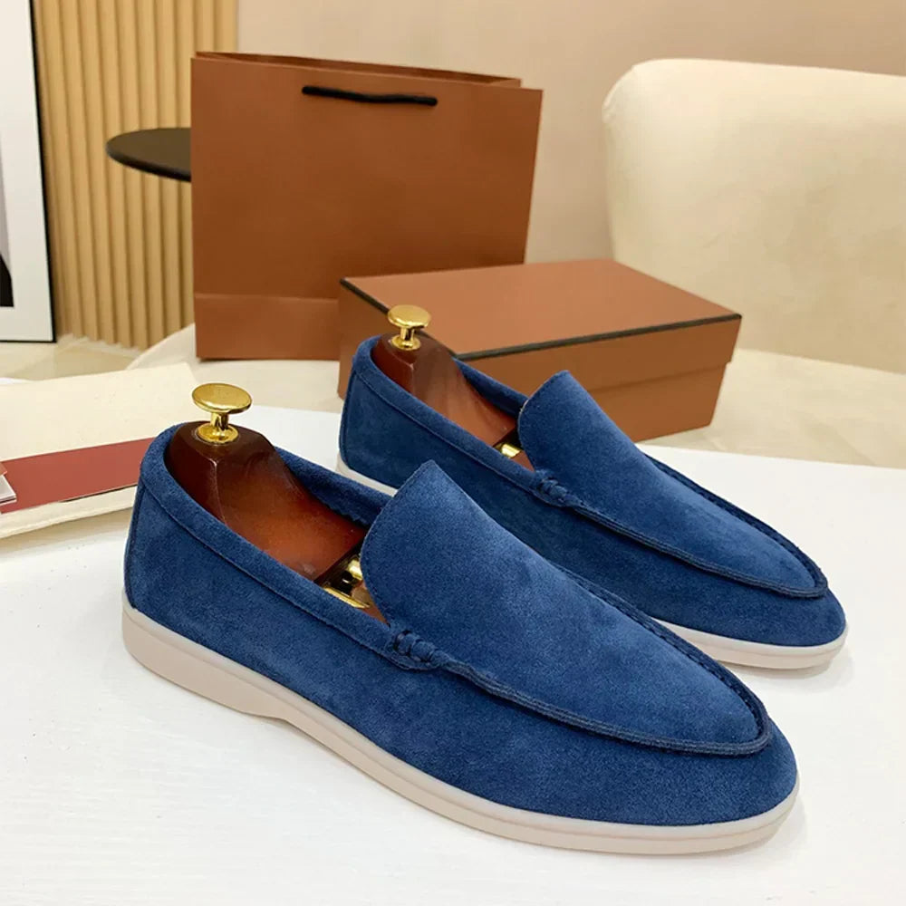 Men's moc toe slip-on loafers with stitched detailing and flat soles