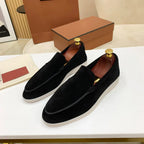 Men's moc toe slip-on loafers with stitched detailing and flat soles