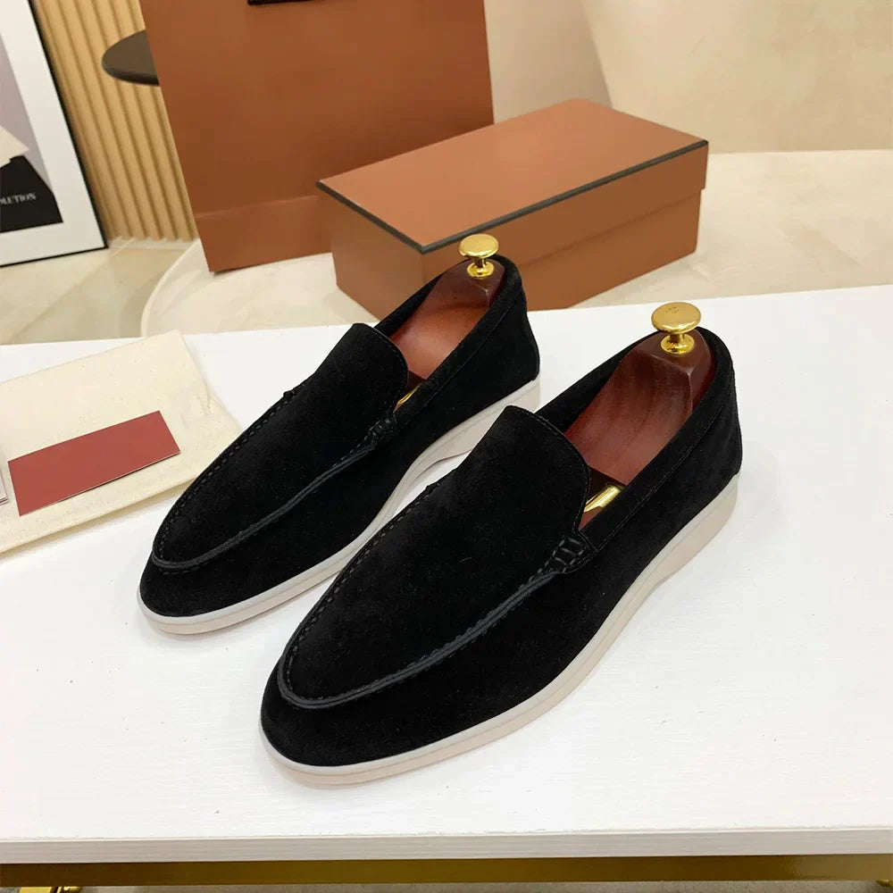 Men's moc toe slip-on loafers with stitched detailing and flat soles