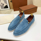 Men's moc toe slip-on loafers with stitched detailing and flat soles