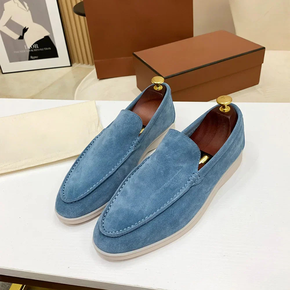 Men's moc toe slip-on loafers with stitched detailing and flat soles