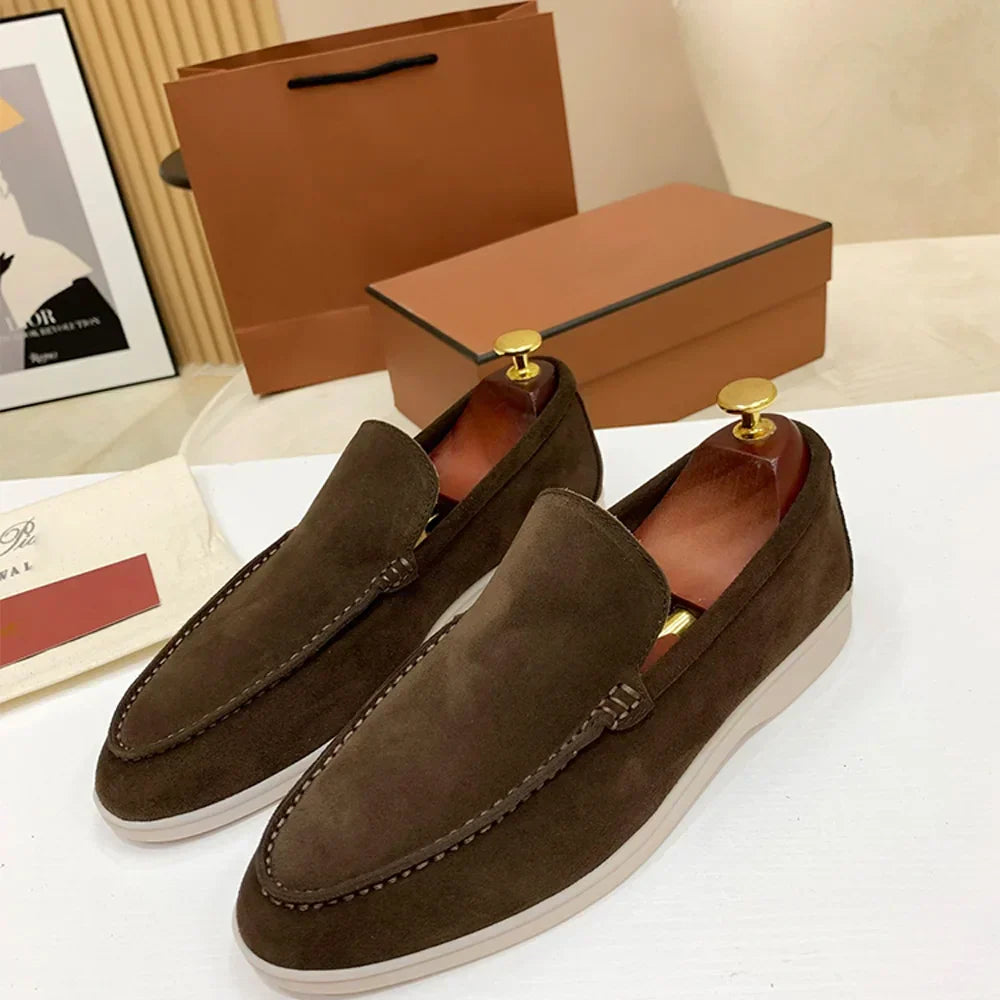 Men's moc toe slip-on loafers with stitched detailing and flat soles