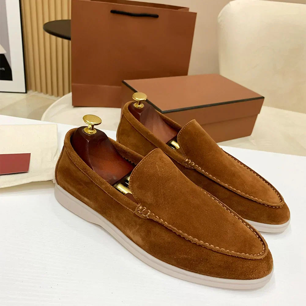 Men's moc toe slip-on loafers with stitched detailing and flat soles