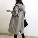 Women's hooded button-front trench coat with long sleeves and side pockets