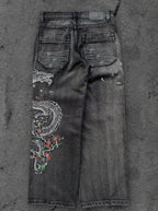 Dark washed wide leg jeans with dragon and floral embroidery