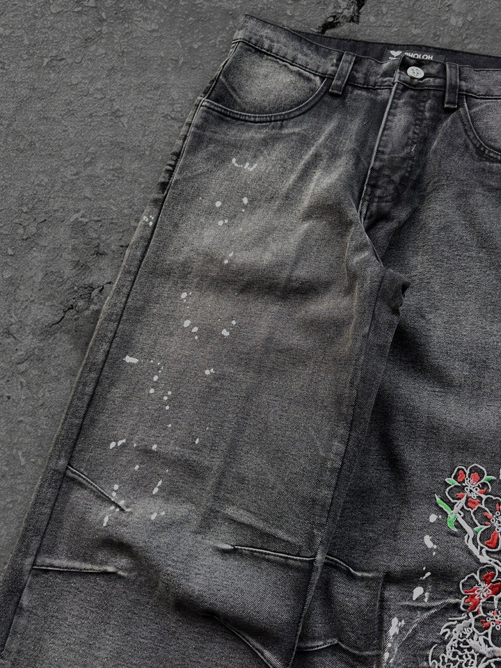 Dark washed wide leg jeans with dragon and floral embroidery