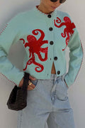 Women's pale blue cardigan with red octopus graphics and button front