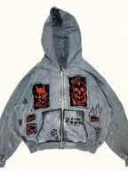 Men's grey zip-up hoodie with hood, graphic patches and front pockets
