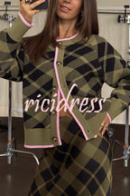 Women's green plaid cardigan with pink trim and buttons