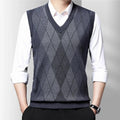 Men's sleeveless argyle V-neck sweater vest layered over a white shirt