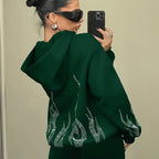 Women's hooded sweatshirt with rhinestone flame detailing on the back and sleeves