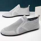Knit barefoot-style slip-on shoes with textured panels and pull tabs