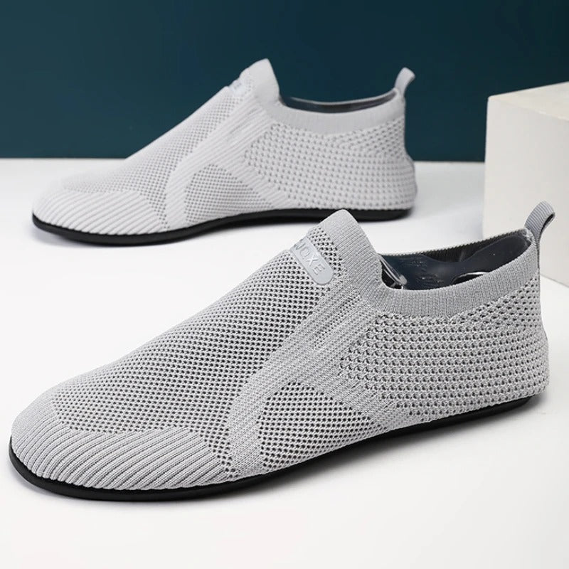 Knit barefoot-style slip-on shoes with textured panels and pull tabs