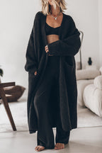 Women's oversized open front knit midi cardigan with long sleeves and front pockets