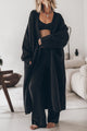 Women's oversized open front knit midi cardigan with long sleeves and front pockets