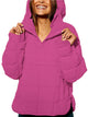 Women's oversized hooded quilted pullover jacket with long sleeves and front pockets