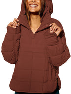 Women's oversized hooded quilted pullover jacket with long sleeves and front pockets