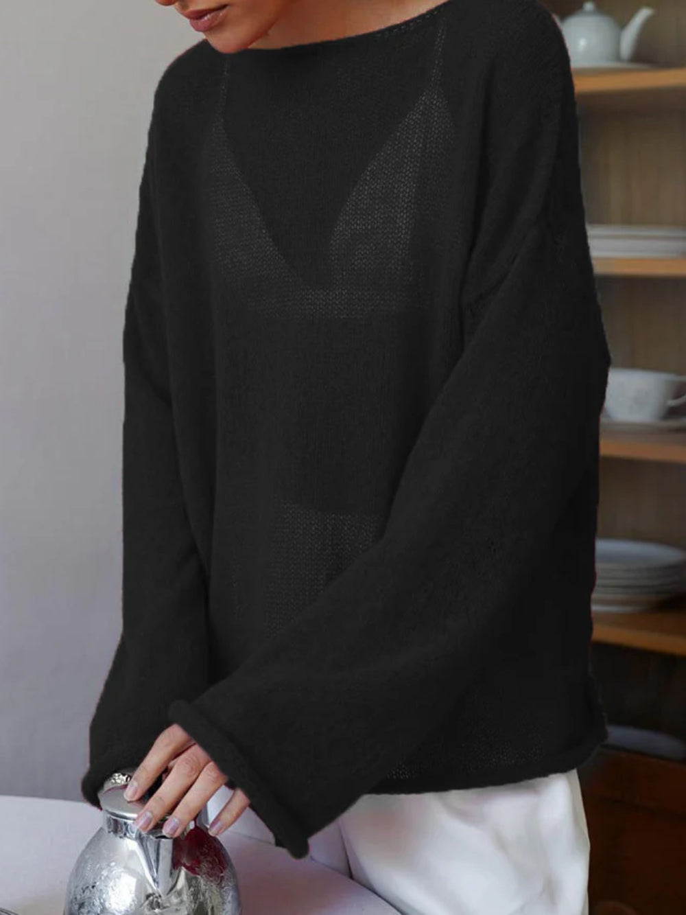 Women's open-knit oversized sweater with wide sleeves and crew neck