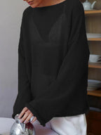 Women's open-knit oversized sweater with wide sleeves and crew neck