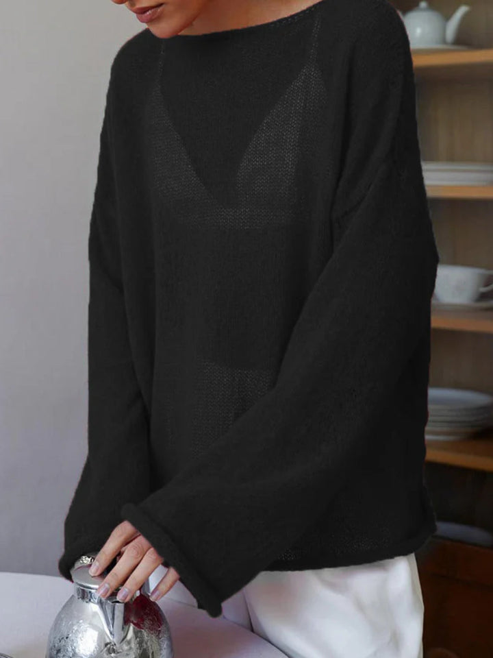 Women's open-knit oversized sweater with wide sleeves and crew neck