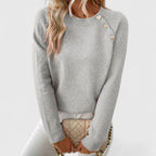 Women's long-sleeve crew neck jumper with shoulder buttons and cropped hem