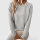 Women's long-sleeve crew neck jumper with shoulder buttons and cropped hem